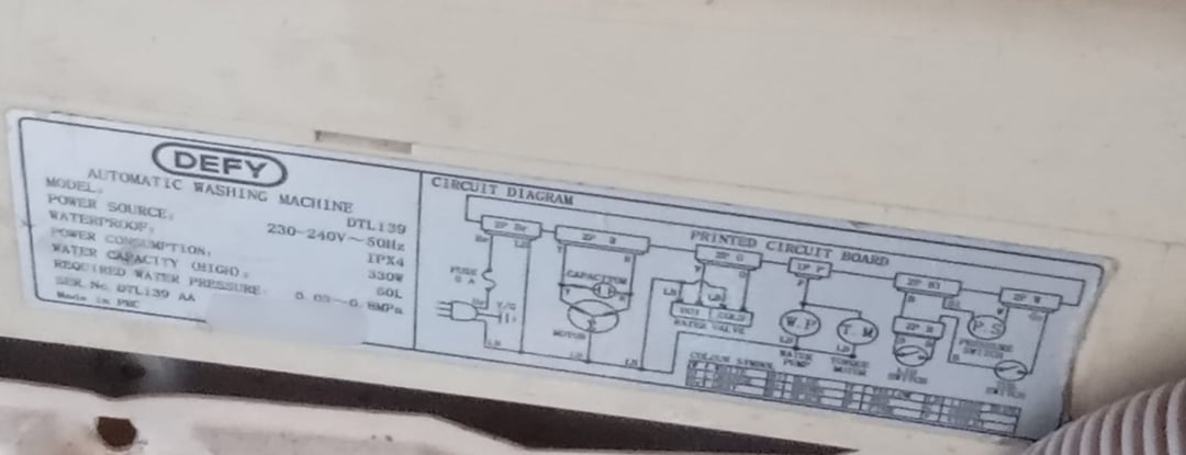 Defy washing machine rating plate showing the model number DTL139